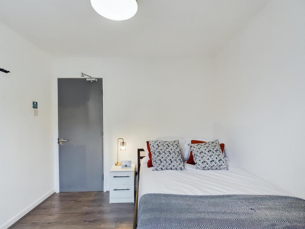 A bright and inviting double bedroom, perfect f...
