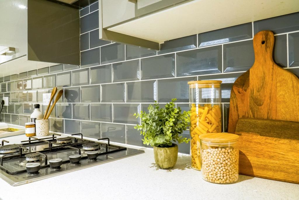 A modern and tidy kitchenette with stylish deco...