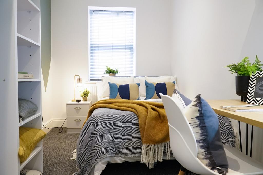 A stylish and inviting double bedroom with ampl...