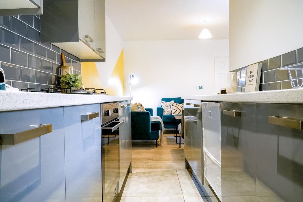 A bright, modern kitchen with plenty of natural...