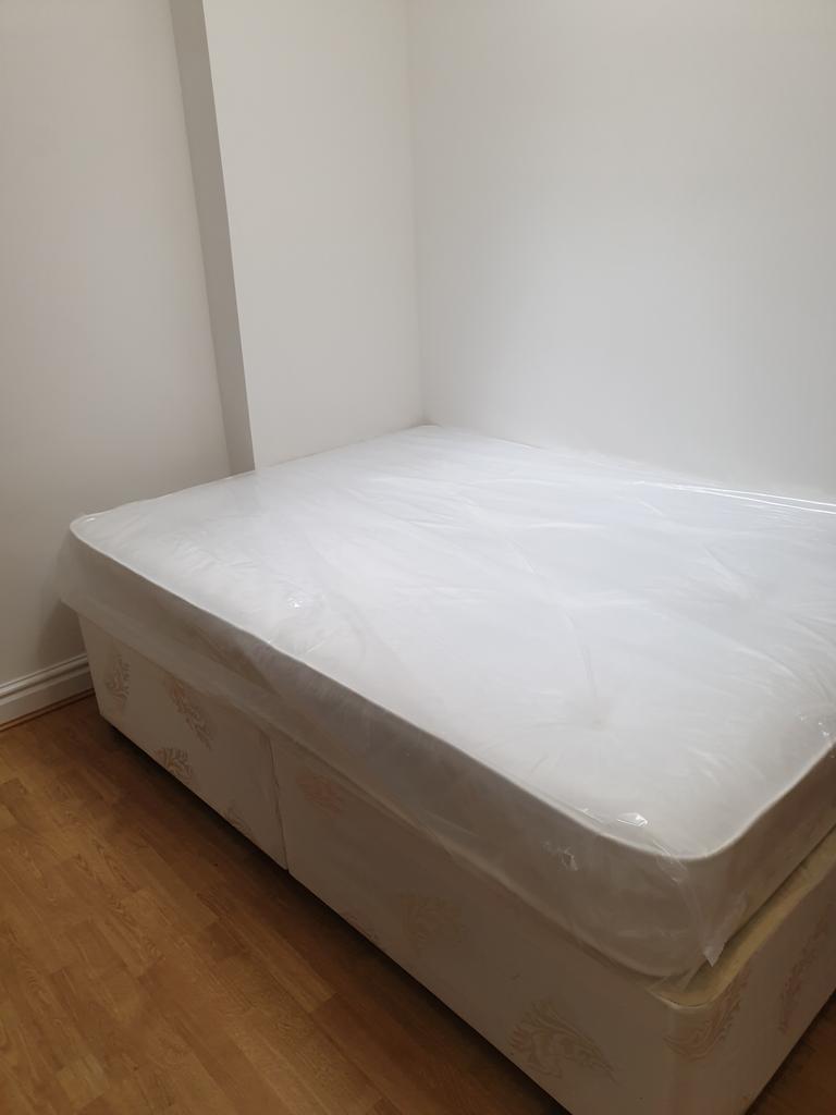 A cozy double bedroom featuring a brand new mat...