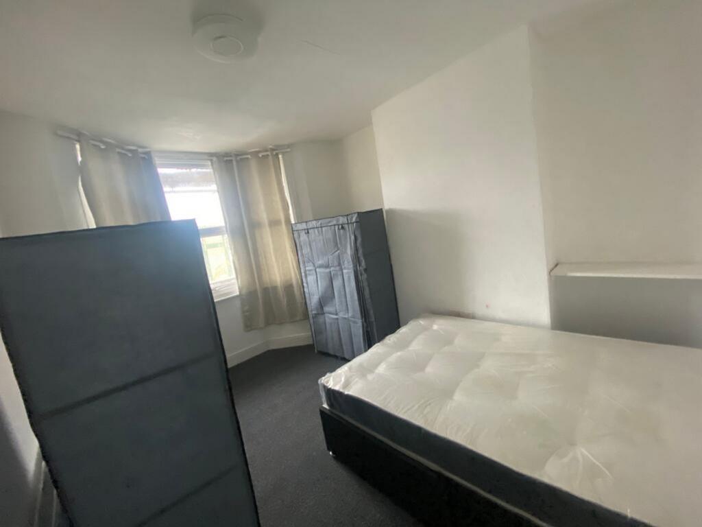 Spacious double bedroom featuring natural light...