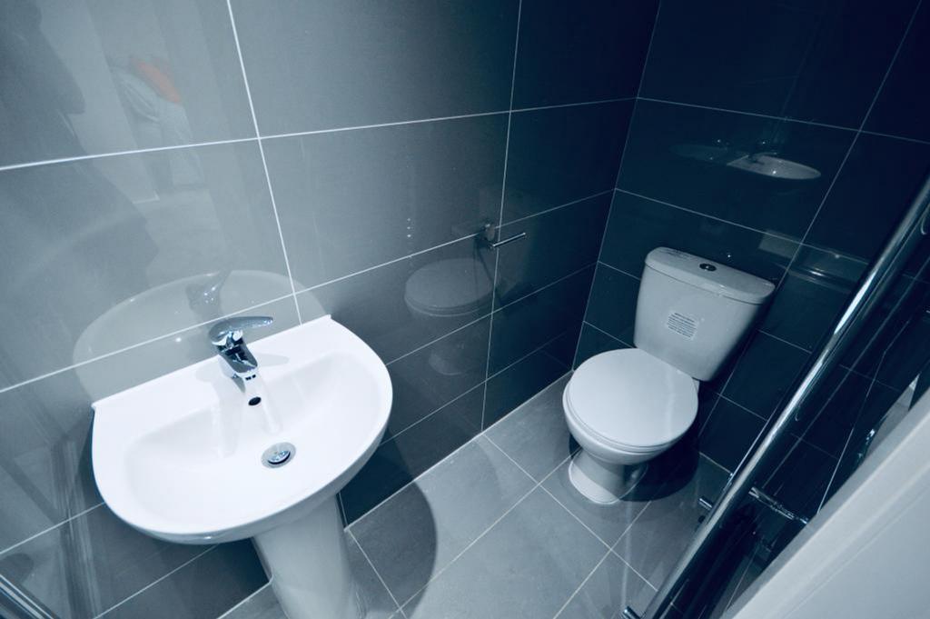 A modern and clean single toilet with sleek des...