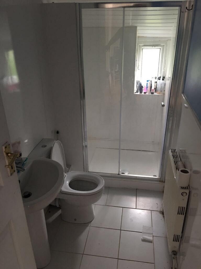 A well-maintained bathroom featuring a modern s...