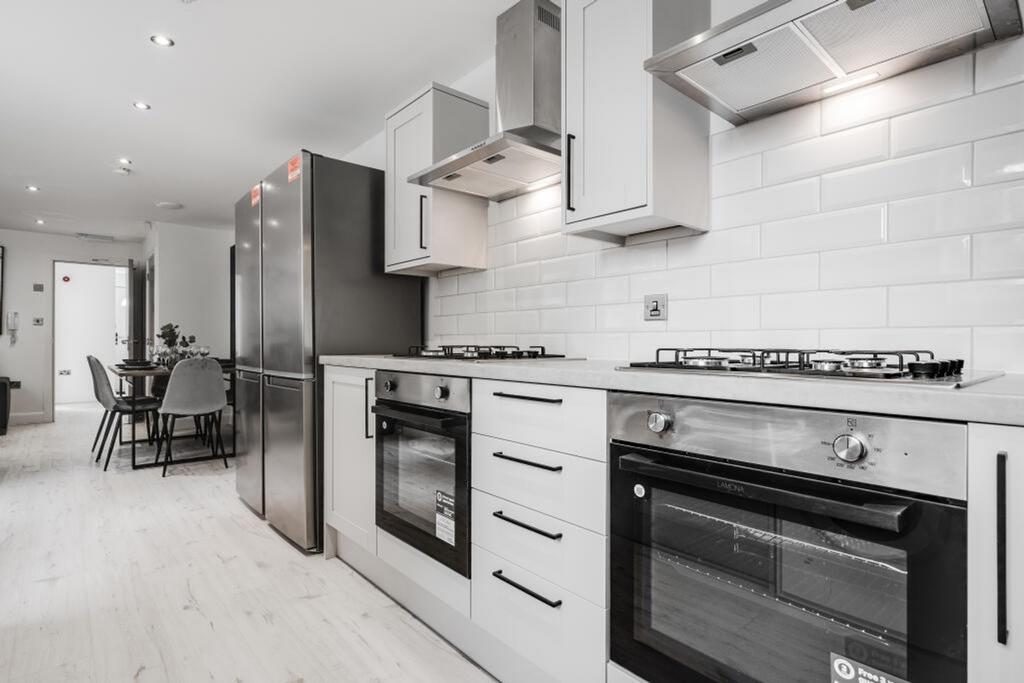 A modern and clean kitchenette featuring sleek ...