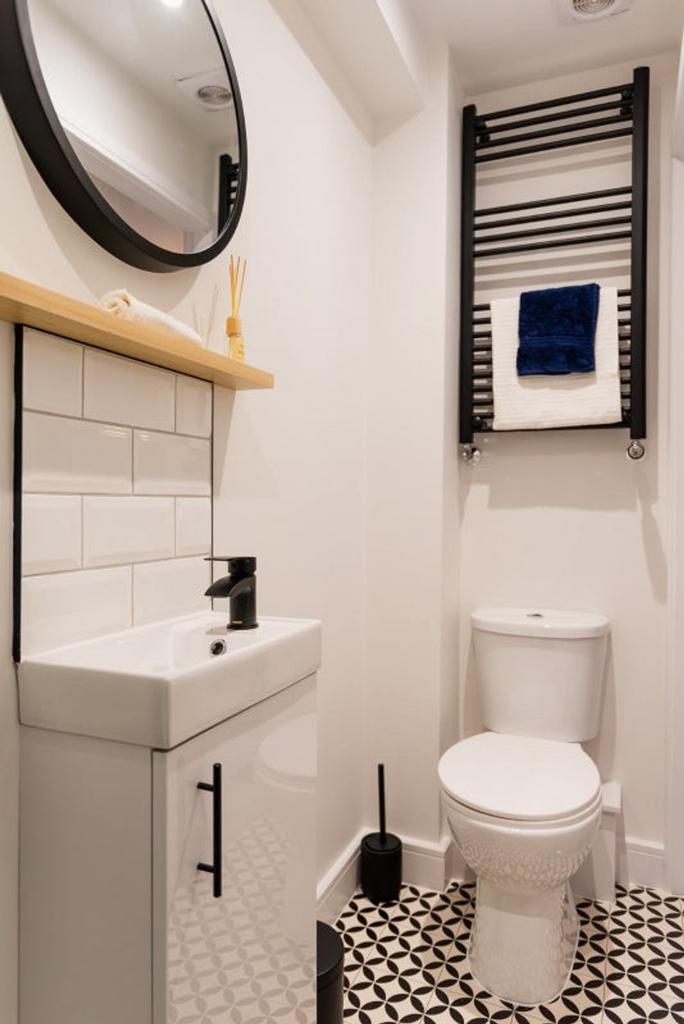 A modern and stylish bathroom featuring a sleek...