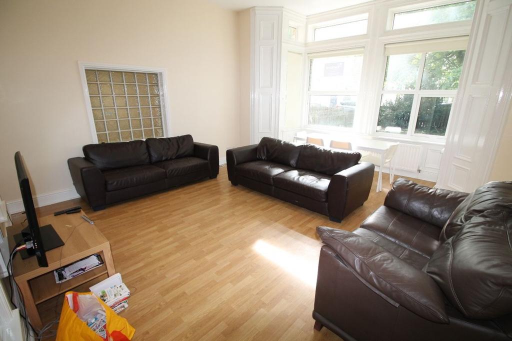 Spacious living room with ample natural light, ...