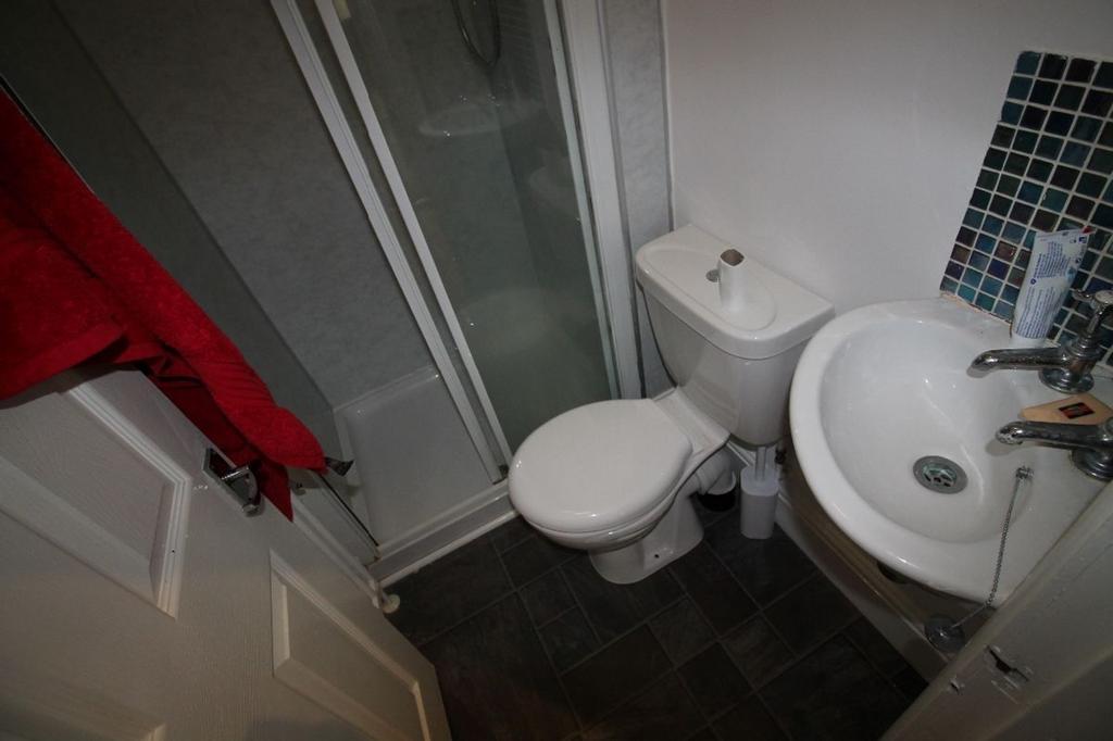 A well-maintained bathroom featuring a modern s...