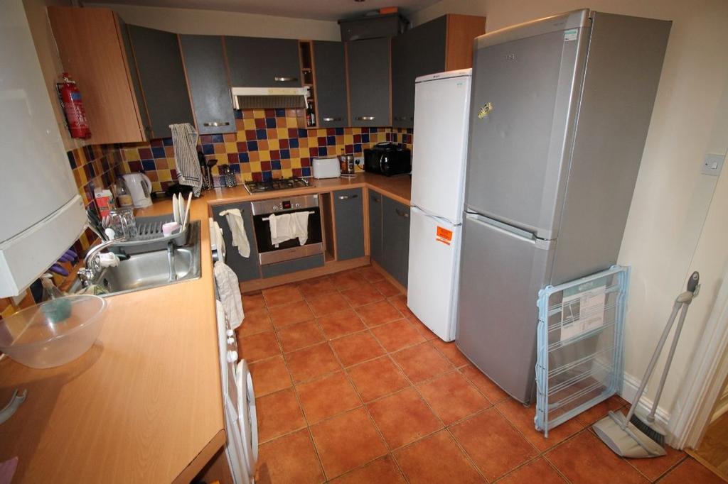 This well-appointed kitchen features modern cab...