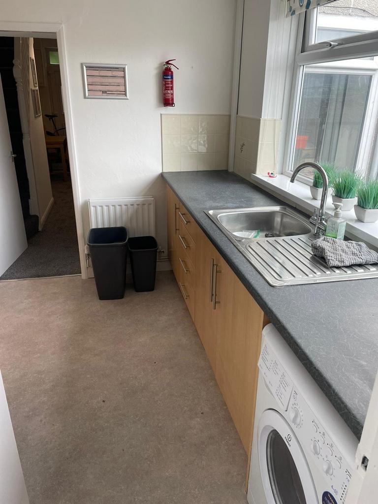 A bright and tidy kitchenette with modern appli...
