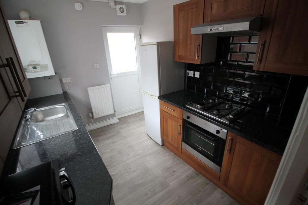 This well-appointed kitchen features modern app...