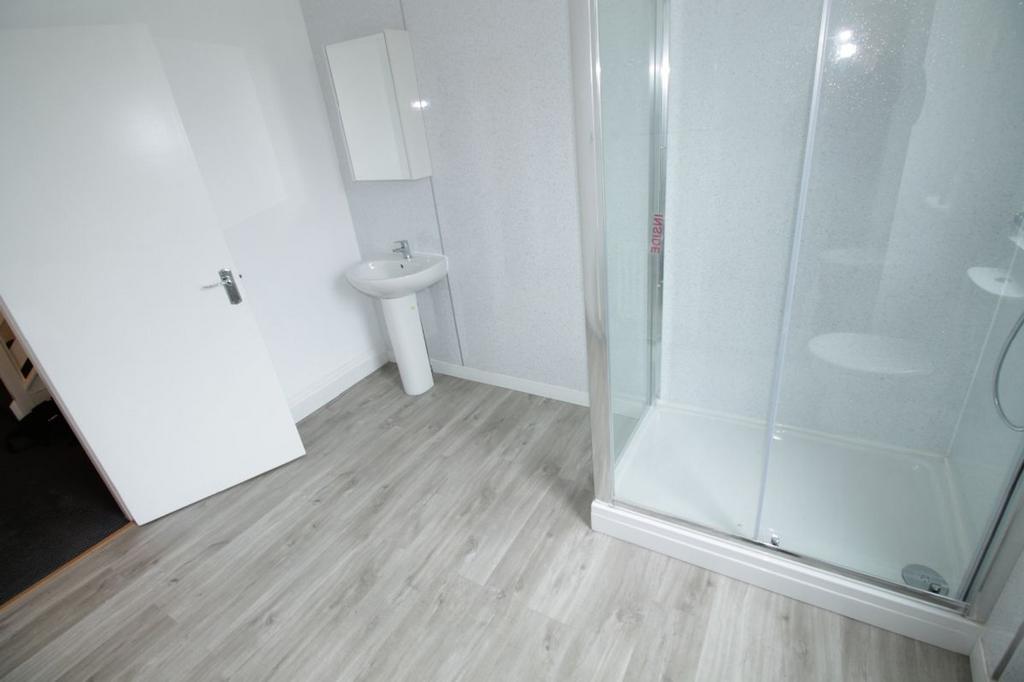 Bright and modern bathroom featuring a spacious...