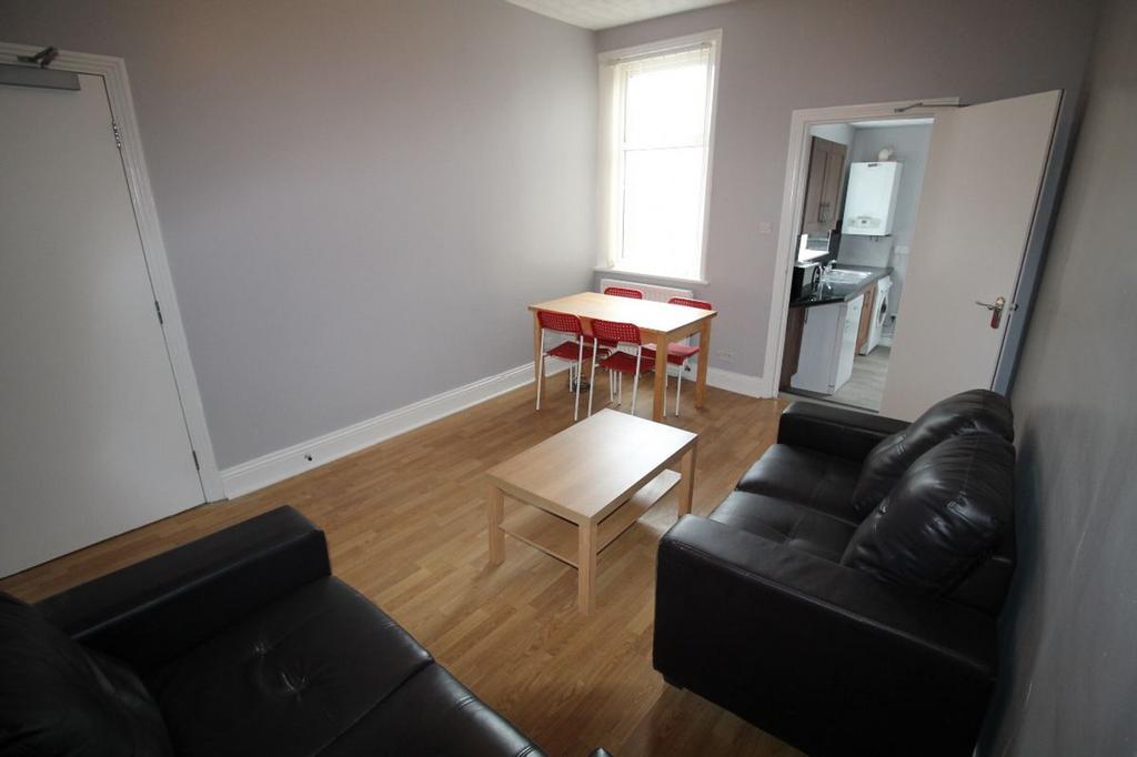 Bright and inviting living room featuring comfo...