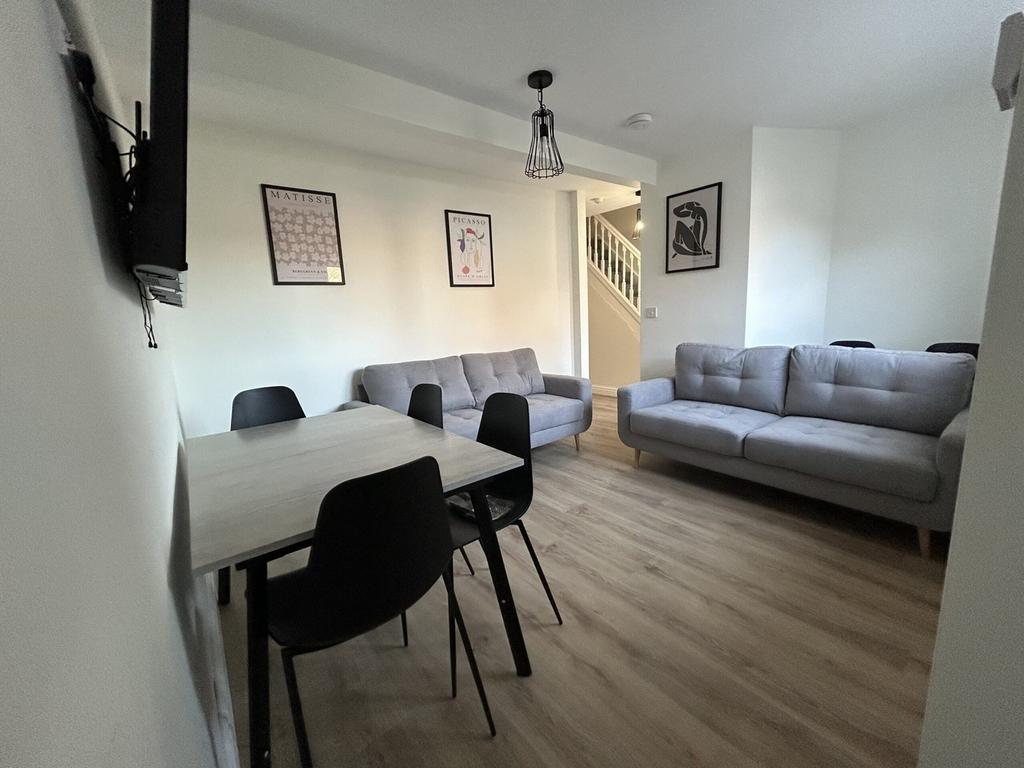 A spacious and inviting modern living room perf...