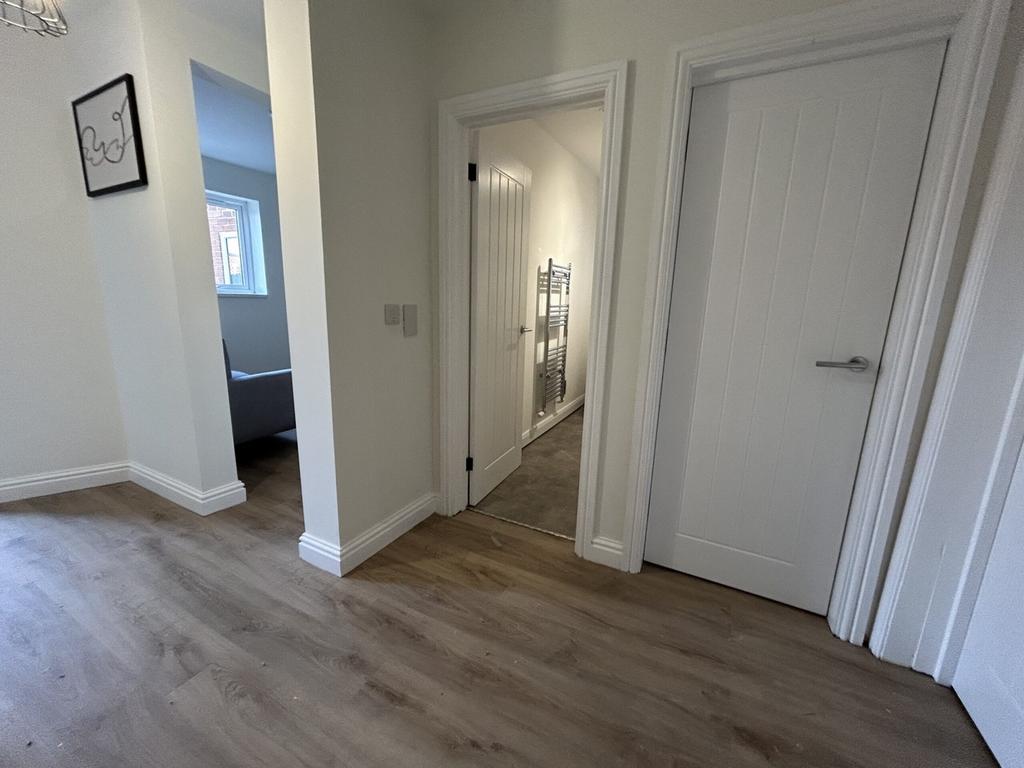 A bright and tidy hallway that welcomes you int...