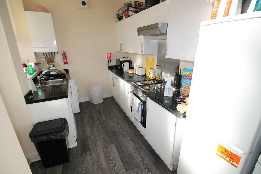 A well-equipped kitchen featuring modern applia...