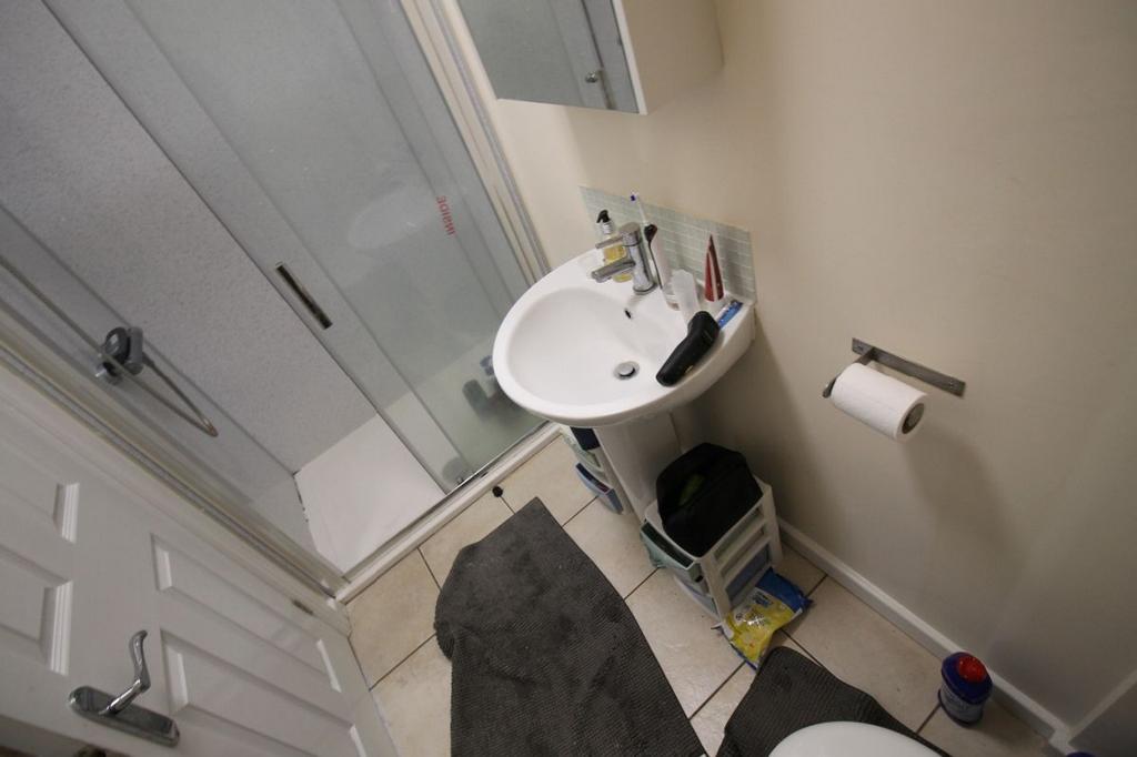 A well-maintained bathroom featuring a modern s...