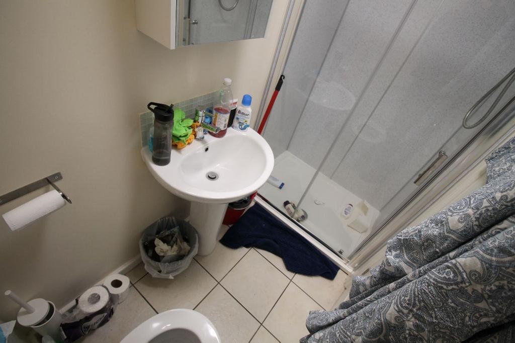 This practical bathroom features a convenient s...