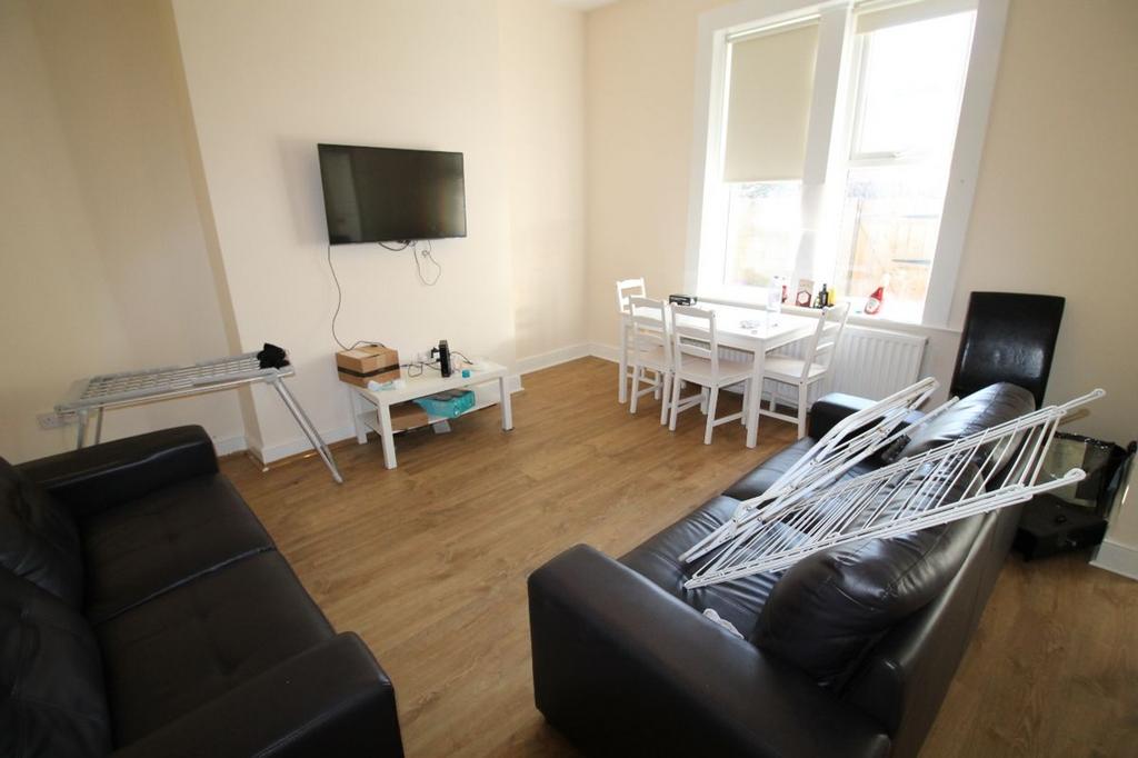 A bright and spacious living room featuring mod...