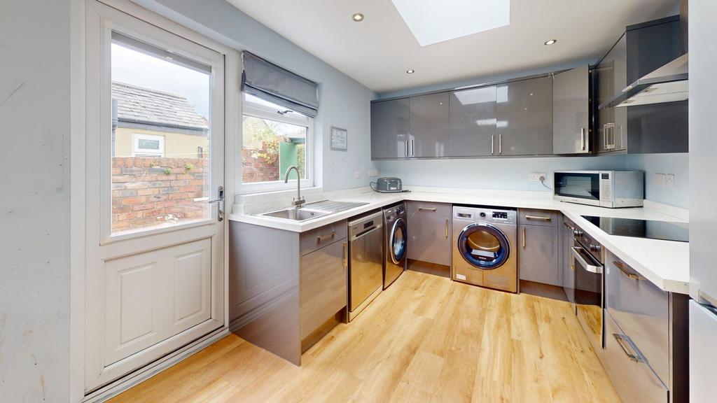 A modern and well-equipped kitchenette with amp...