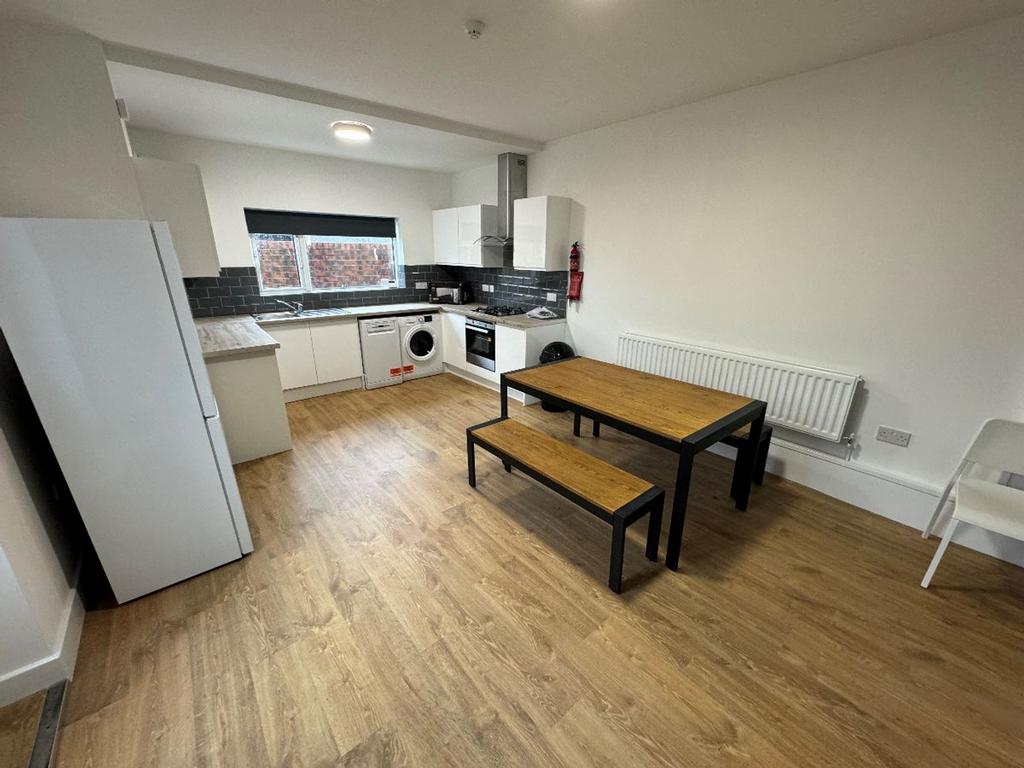 Modern kitchen with ample space for cooking and...