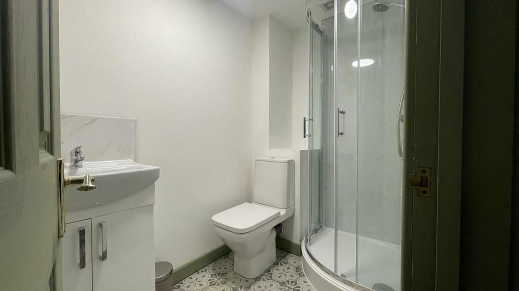A clean and modern bathroom featuring a stylish...