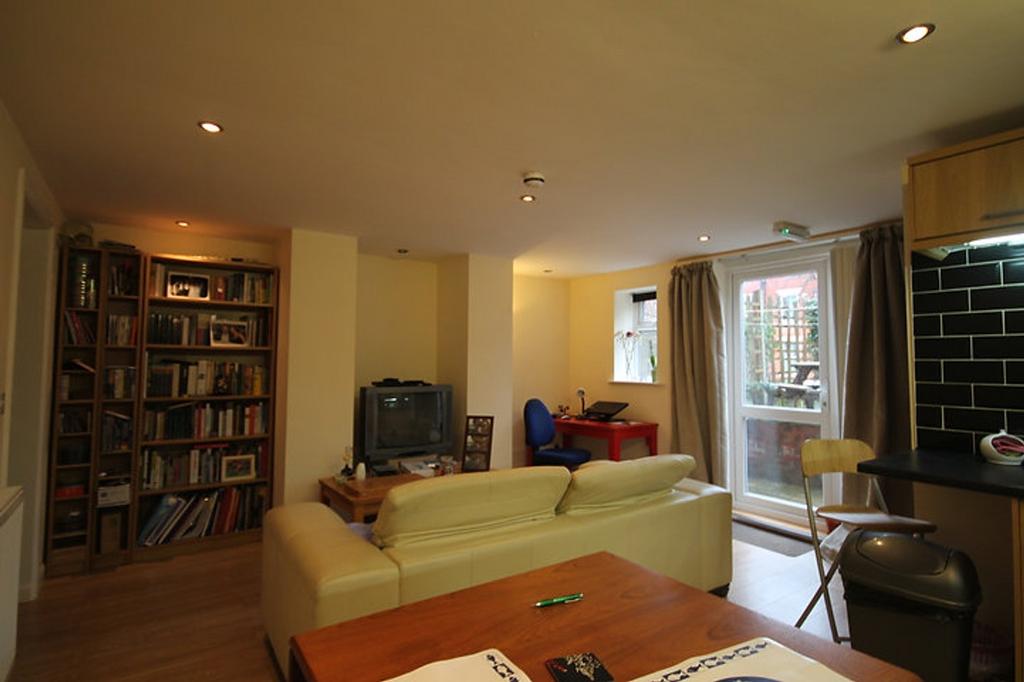 A cozy living room featuring a comfortable seat...