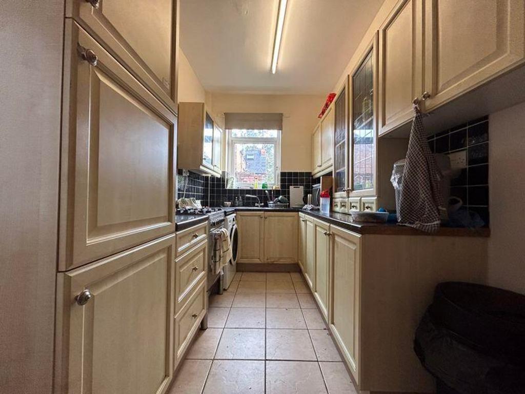 A spacious and functional kitchen with ample st...