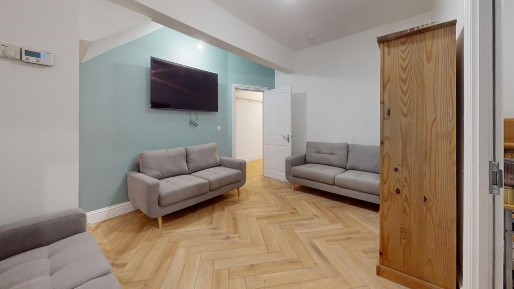 A spacious and inviting modern living room, per...