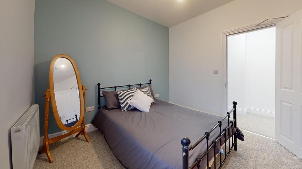 A stylish and inviting double bedroom featuring...