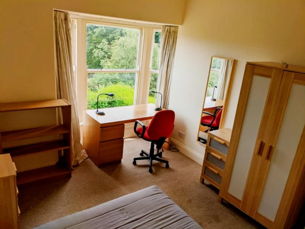 A bright and spacious double bedroom featuring ...