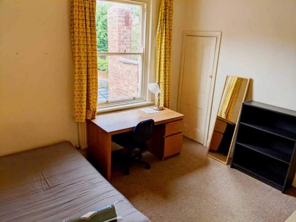 A bright and inviting double bedroom featuring ...