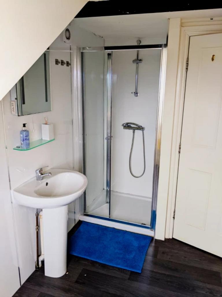 A modern and clean bathroom featuring a spaciou...