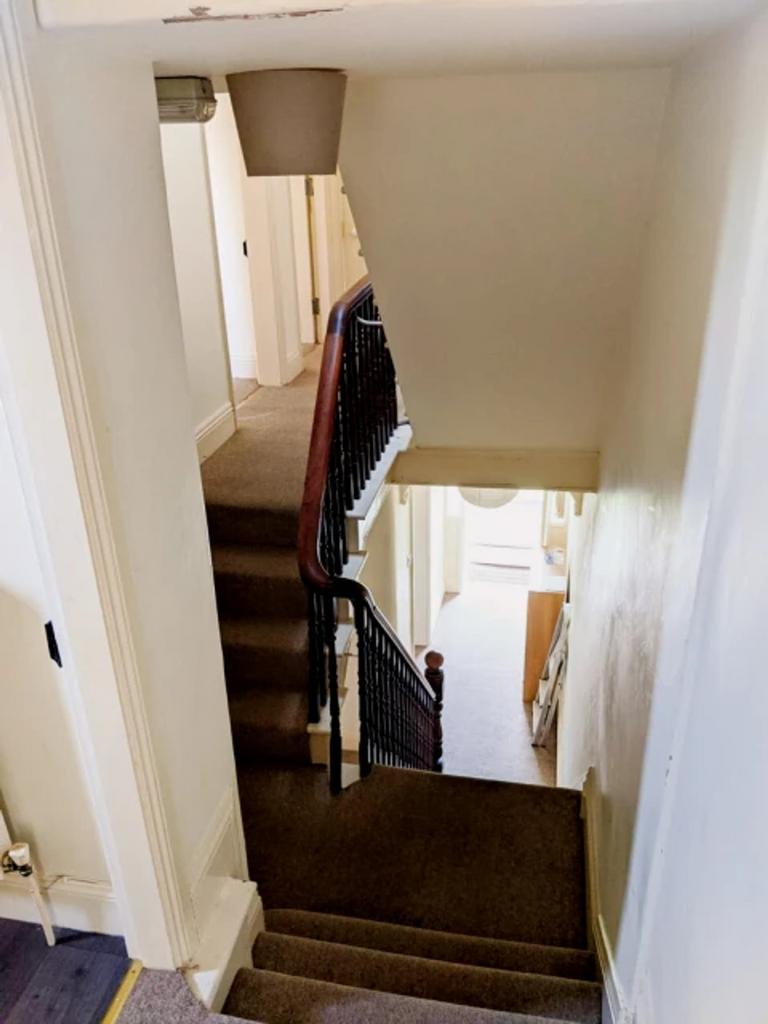 A clean and well-maintained staircase leading t...