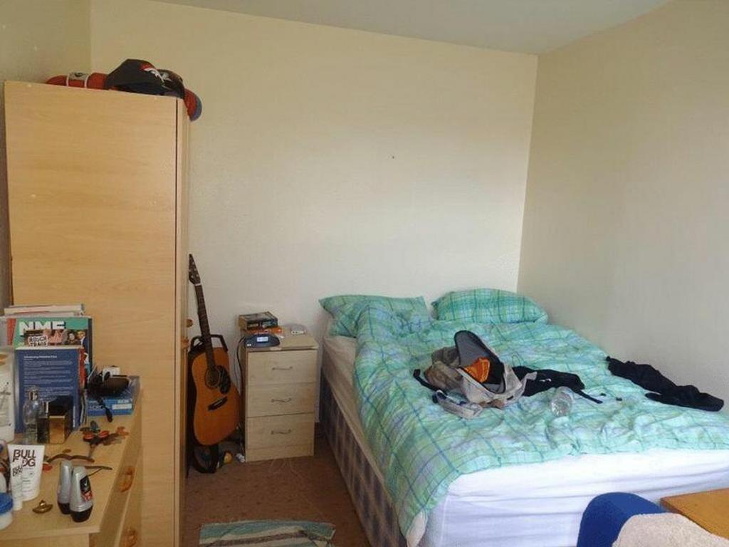 A cozy double bedroom with a comfortable bed an...