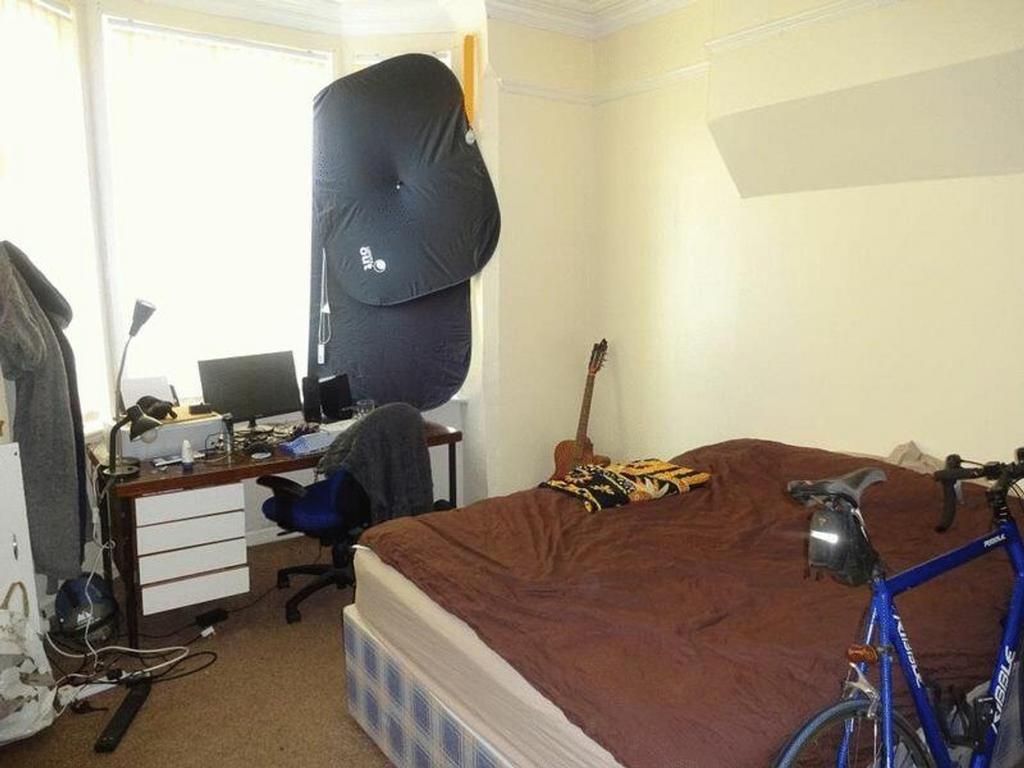 A cozy double bedroom with a comfortable bed an...