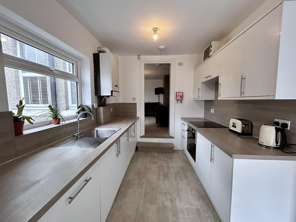 A bright and modern kitchenette featuring ample...
