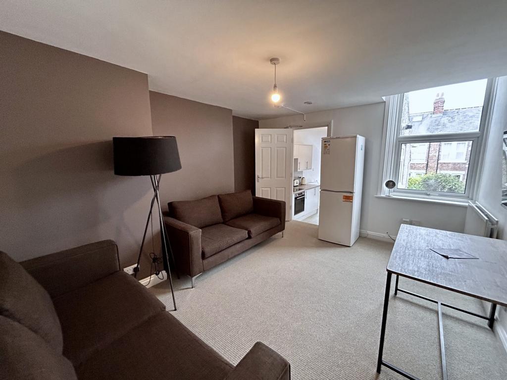 A spacious and inviting modern living room with...