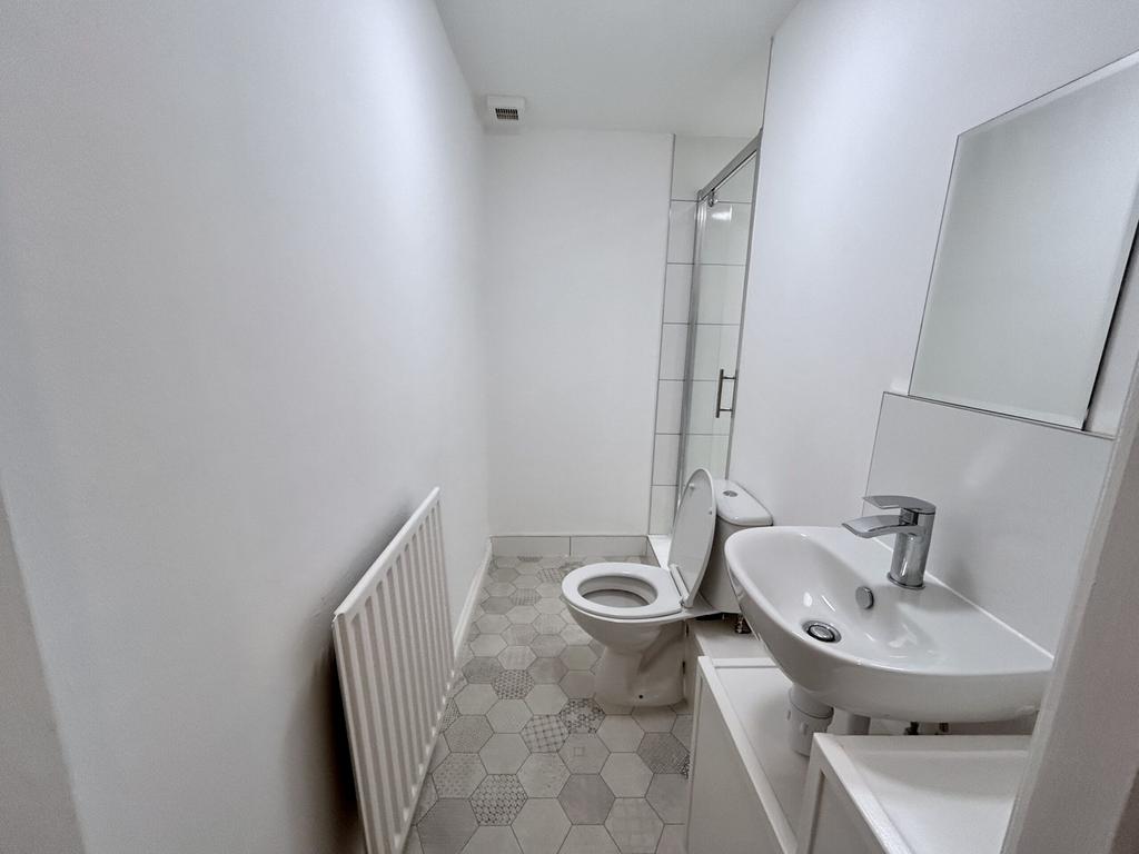 A bright and clean bathroom featuring modern fi...