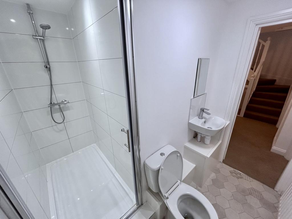 A modern and pristine bathroom featuring a spac...