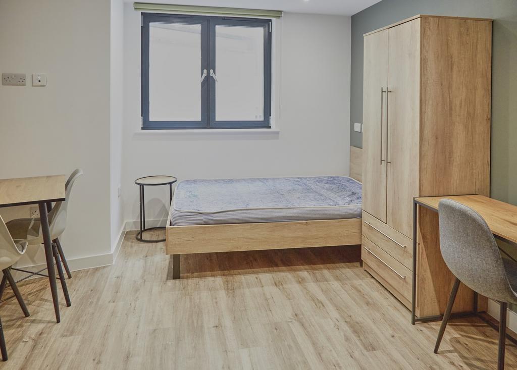A bright and inviting double bedroom featuring ...