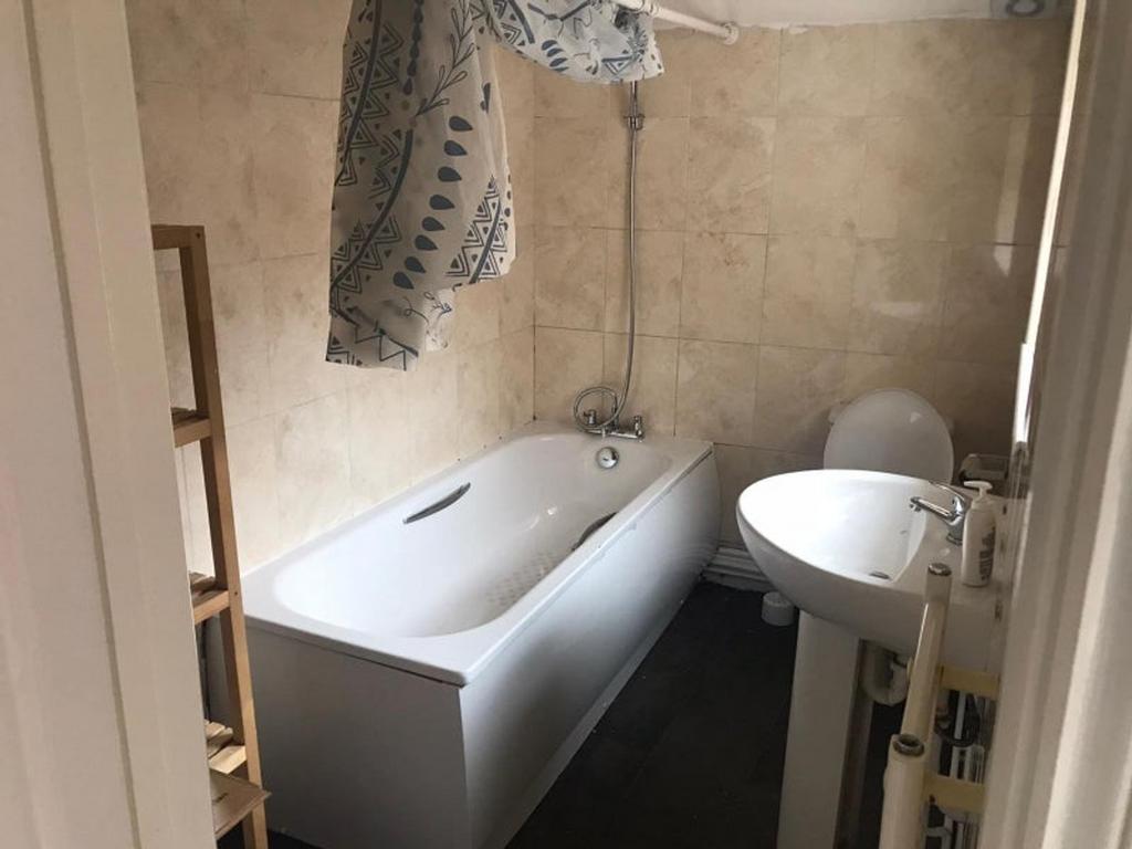 A clean and functional bathroom featuring a bat...