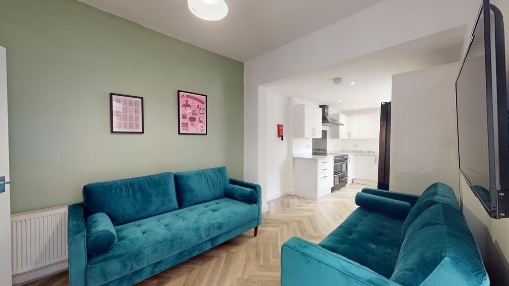 A spacious and stylish modern living room featu...