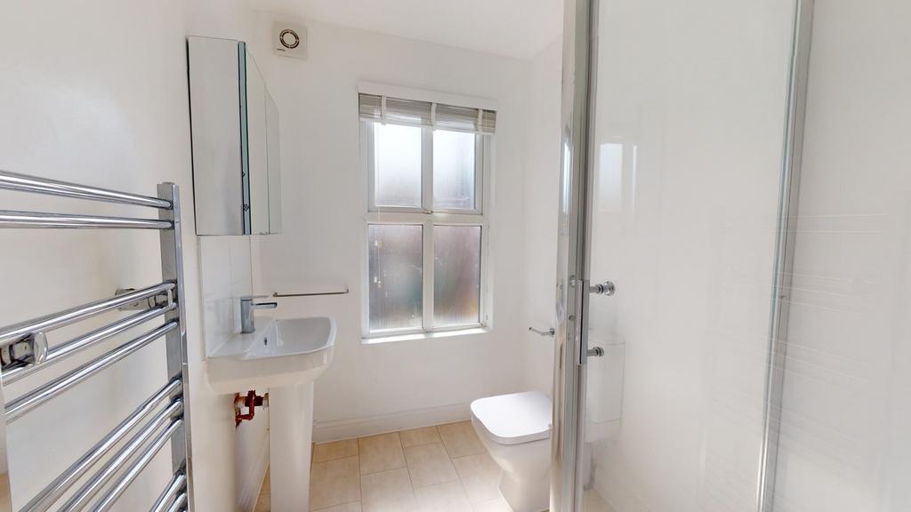 A bright and modern bathroom featuring a sleek ...
