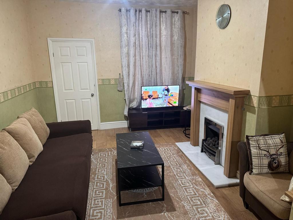 A cozy living room featuring a comfortable sofa...