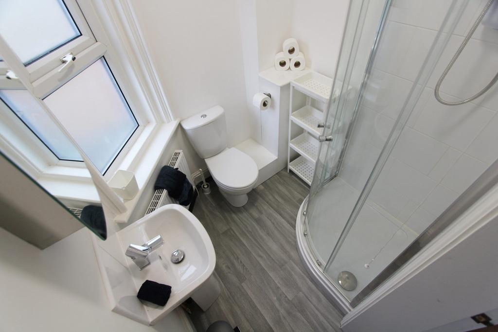 A bright and modern bathroom featuring a sleek ...
