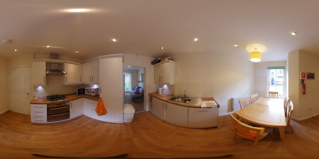 A bright and spacious kitchen with modern appli...