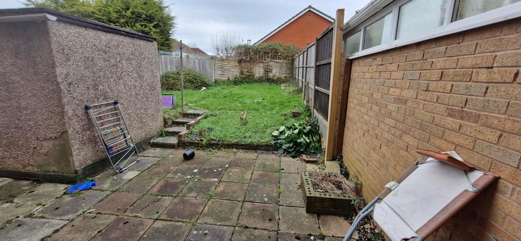 A spacious garden area with potential for outdo...
