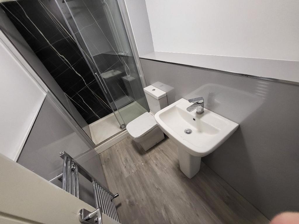 A modern bathroom featuring a sleek design with...