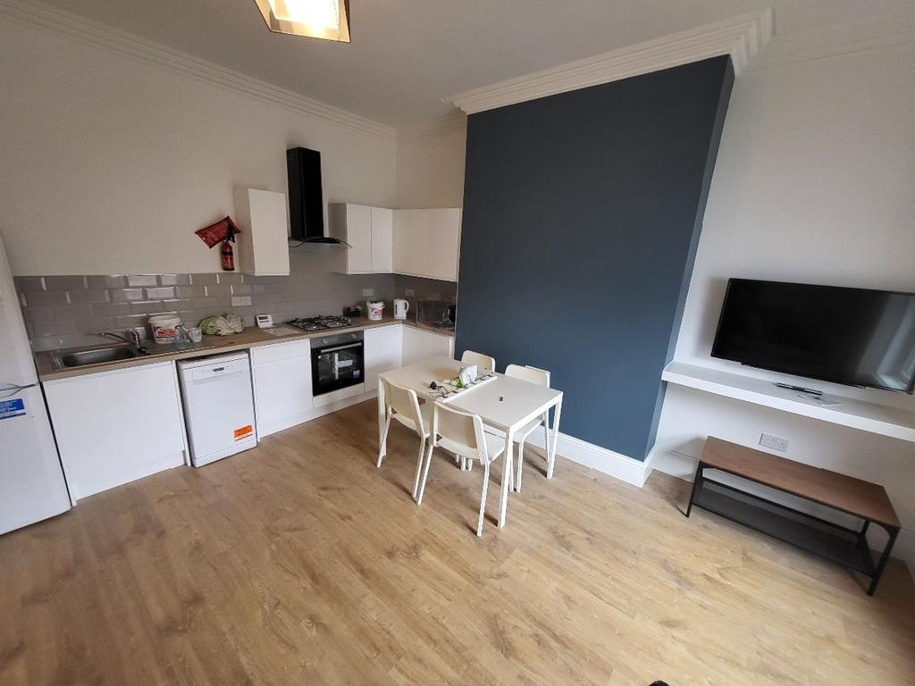 Spacious kitchen featuring modern appliances, a...